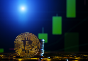 Moeda de Bitcoin com fundo de gráficos de cotação